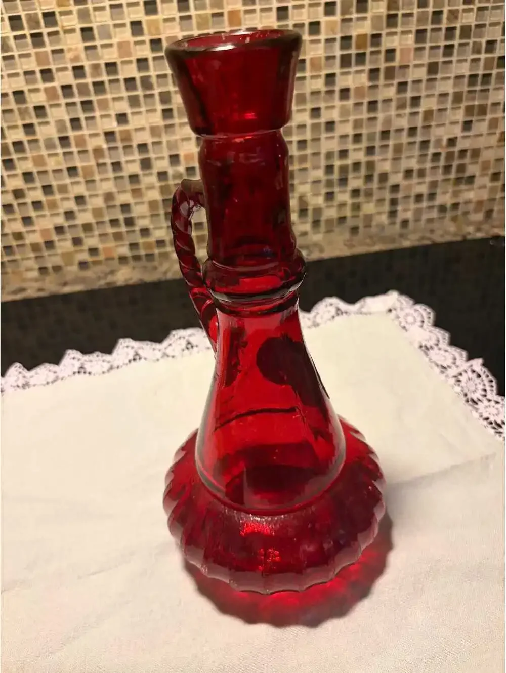 This is a vintage 1970s Jim Beam ruby red glass genie decanter.